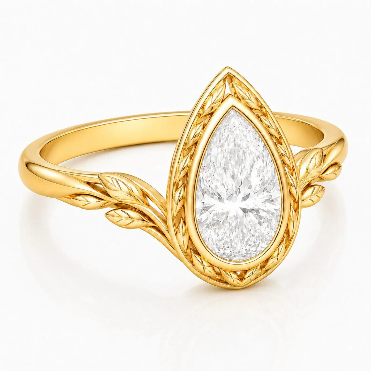 Close-up perspective view of 3 CT pear cut lab grown diamond in yellow gold leaf textured bezel setting.