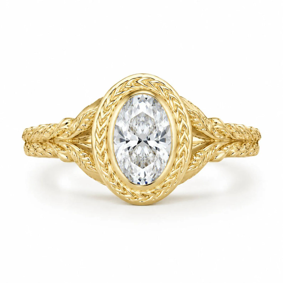 Direct top-down view of a 3 carat oval lab created diamond framed in a laurel leaf engraved yellow gold bezel.