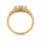 Side profile view showing the low-profile undergallery and leaf textured band of a 3 CT oval diamond bezel ring.