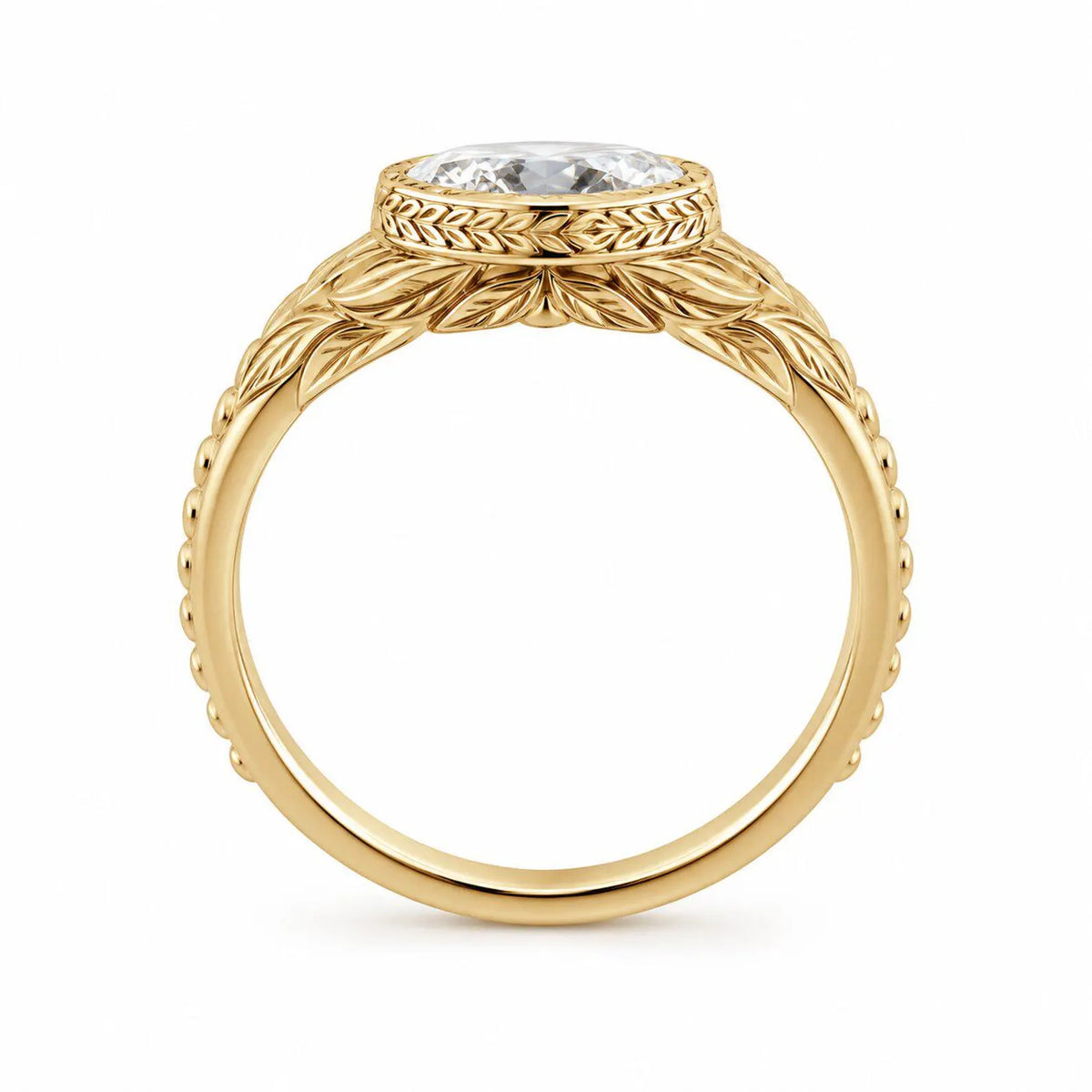 Side profile view showing the low-profile undergallery and leaf textured band of a 3 CT oval diamond bezel ring.