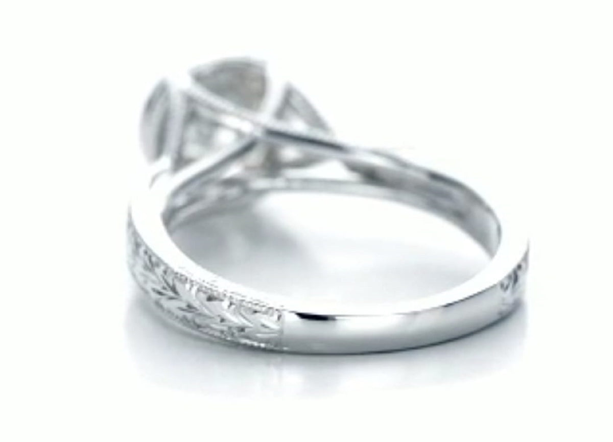 Rear angle showcasing the hand-engraved band transition to polished inner shank.