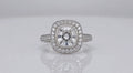 Direct face-up top view of a 3 carat cushion cut lab grown diamond surrounded by a vintage milgrain halo setting.