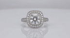Direct face-up top view of a 3 carat cushion cut lab grown diamond surrounded by a vintage milgrain halo setting.