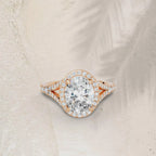 3 carat oval cut lab grown diamond halo ring with a pave split shank in rose gold.