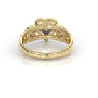 Underside structural gallery view of a 14K yellow gold bezel ring showcasing heart-shaped light cutouts behind three heart-cut lab-grown diamonds.