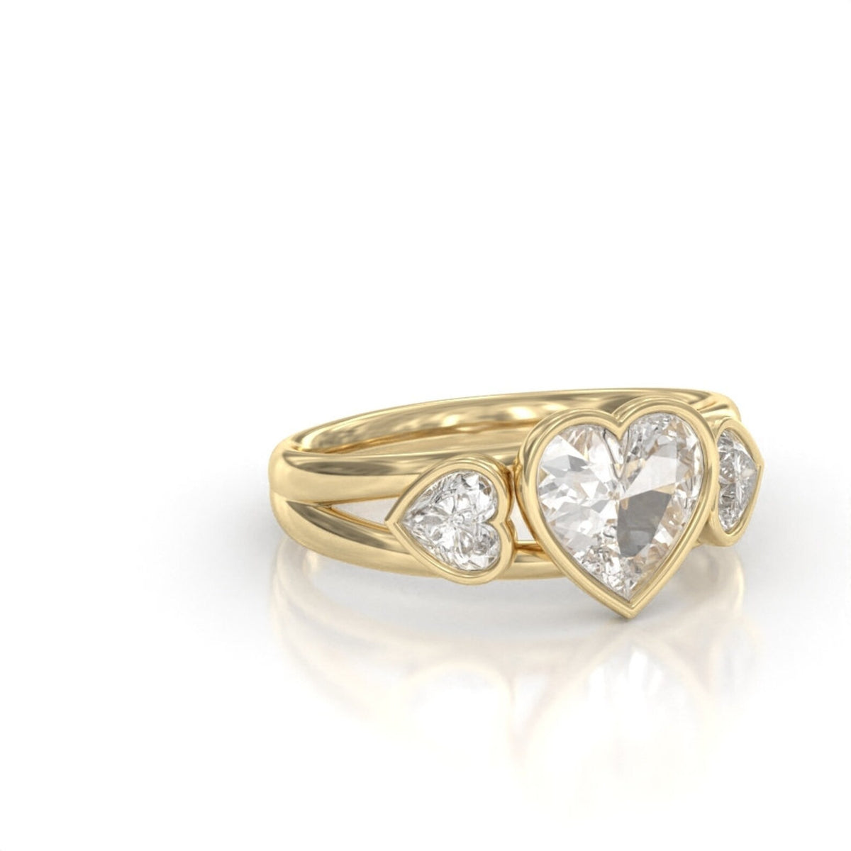 Angled side view of a 2 carat heart-cut lab-grown diamond three-stone ring set in smooth 14K yellow gold bezel setting.