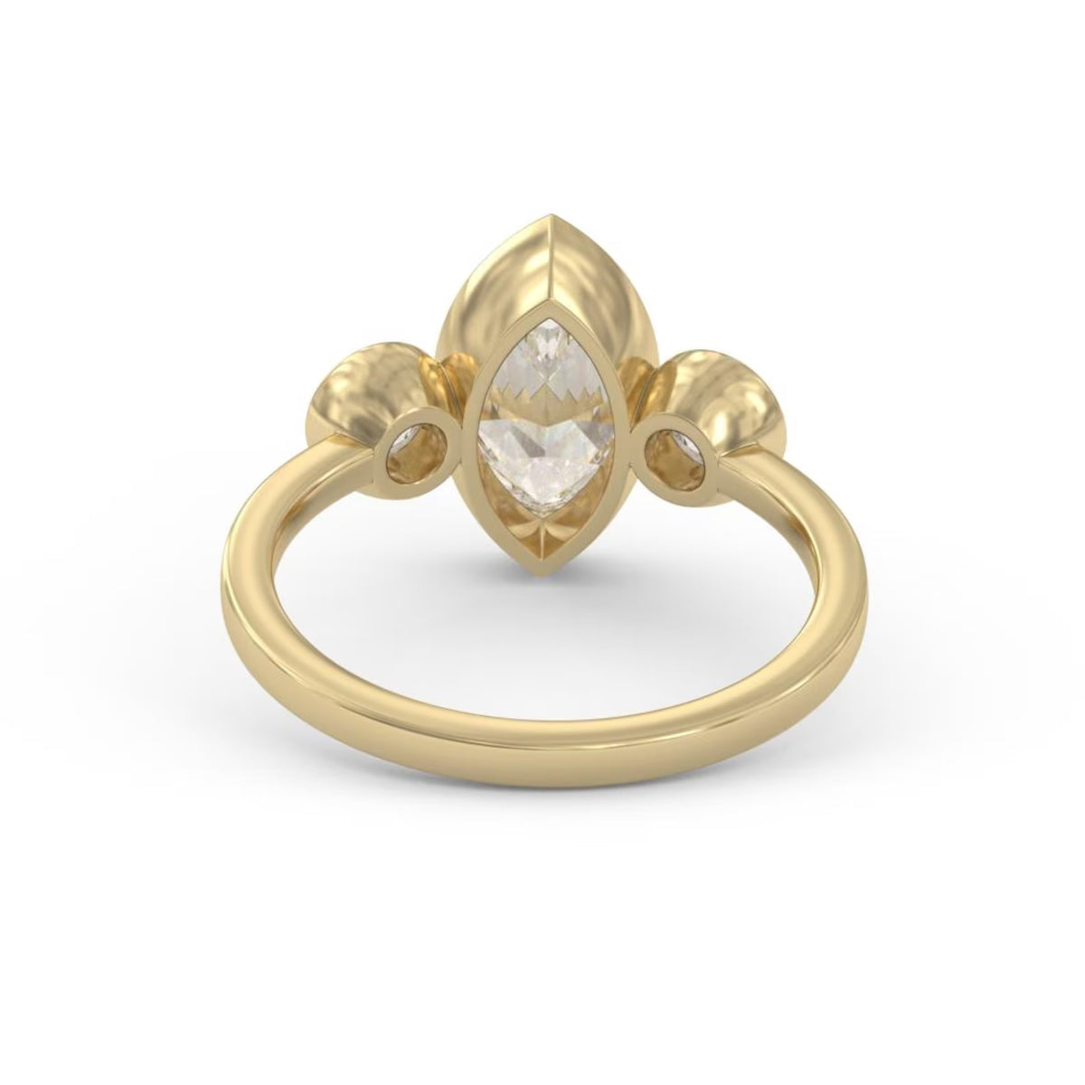 Angled view of a 3 carat marquise lab-grown diamond bezel ring flanked by round bezel side stones in 14K yellow gold.