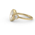 Side profile of a low-profile 3 carat marquise lab diamond engagement ring with round bezel side stones on a smooth gold band.