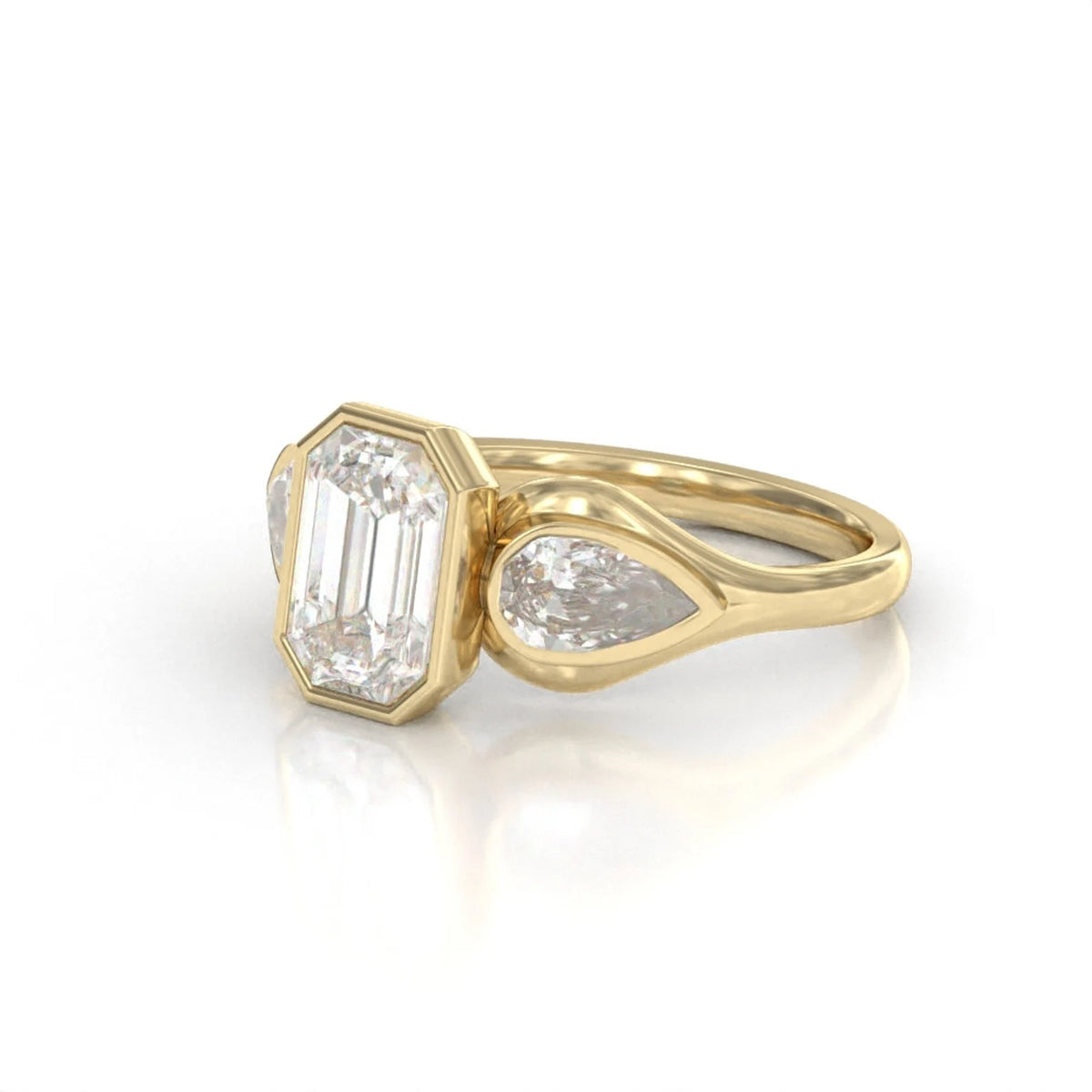Three-quarter side perspective of a 3 carat emerald cut bezel engagement ring in yellow gold.