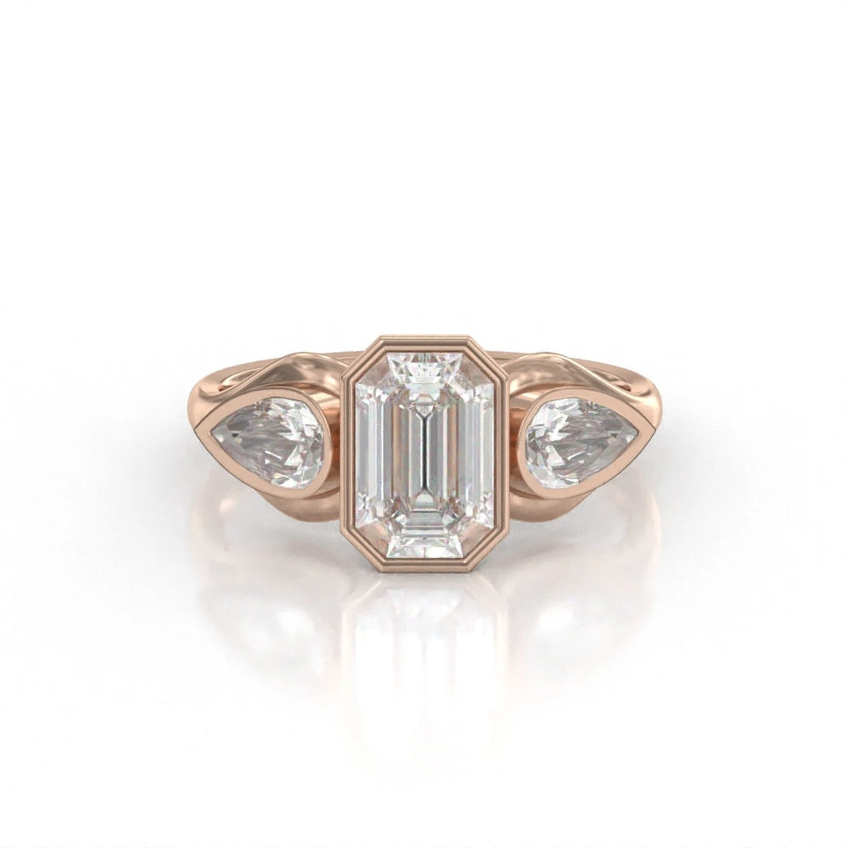 Front view of a 3 carat emerald cut bezel set lab grown diamond ring with pear side stones in rose gold.