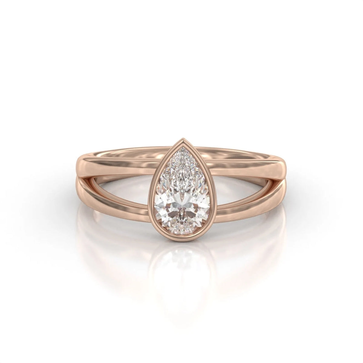 Rose gold 2 carat pear cut lab grown diamond ring with modern bezel setting and dual band split shank.