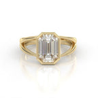 Front view of 3 CT emerald cut lab grown diamond engagement ring in yellow gold bezel setting with split shank band.