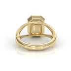 Rear view showing smooth inner band and undergallery of yellow gold 3 carat emerald diamond bezel ring.