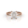 Front view of a 3 CT emerald cut lab grown diamond engagement ring set in rose gold with a split shank band.