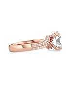 Side profile view of a rose gold 2 carat oval cut lab grown diamond bypass ring with double-row pave details.
