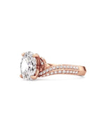 Three-quarter top view of a 2 carat oval cut lab grown diamond on a sweeping rose gold pave band.