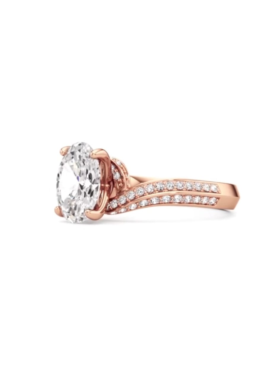 Three-quarter top view of a 2 carat oval cut lab grown diamond on a sweeping rose gold pave band.