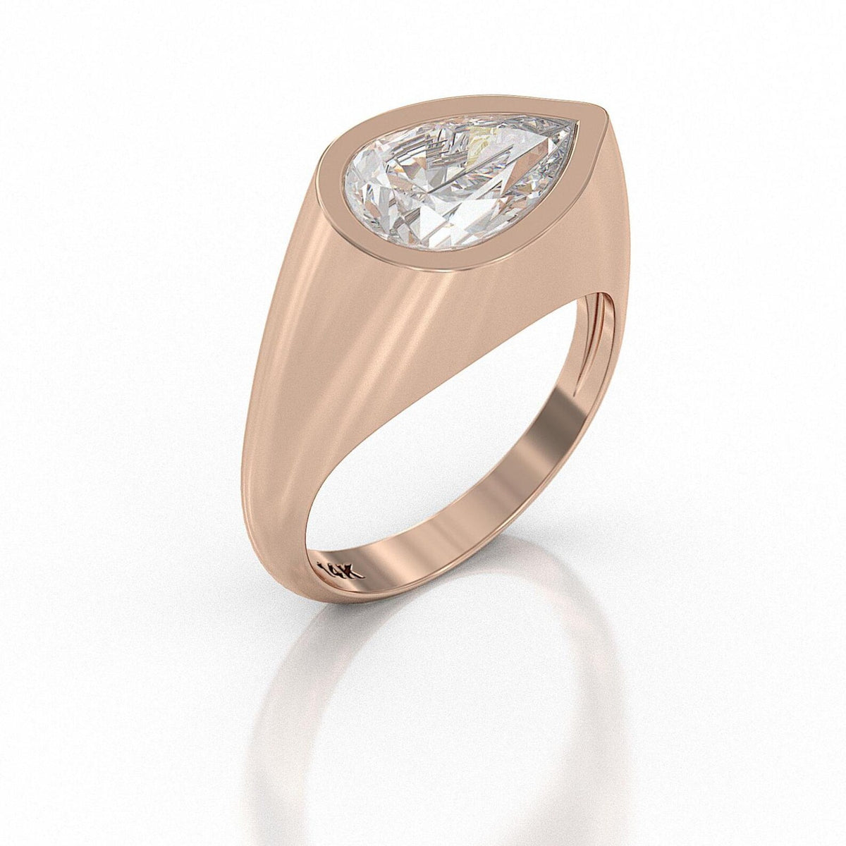 Perspective view of a 3 CT pear cut lab grown diamond set horizontally in a yellow gold flush signet band.
