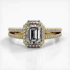 Front top-down perspective of 2 carat emerald cut lab diamond engagement ring in yellow gold with split shank.