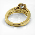 Perspective view showing the interior finish and cathedral setting base of a yellow gold emerald cut lab diamond ring.