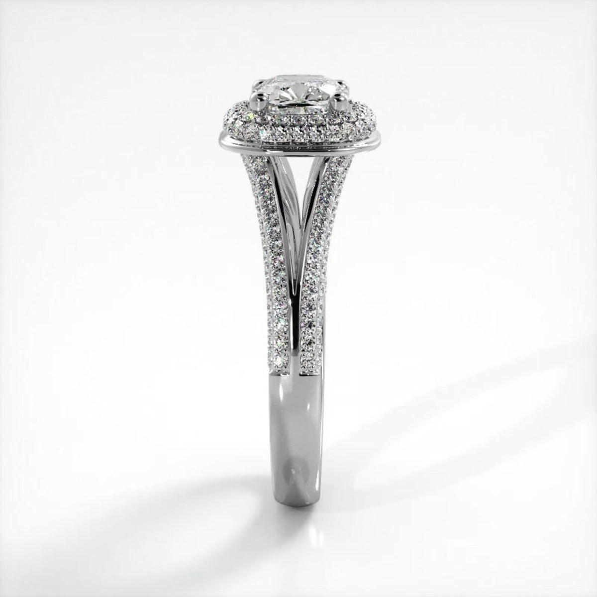 Side profile view of white gold 2 carat cushion cut lab grown diamond ring showing pave split shank detail.