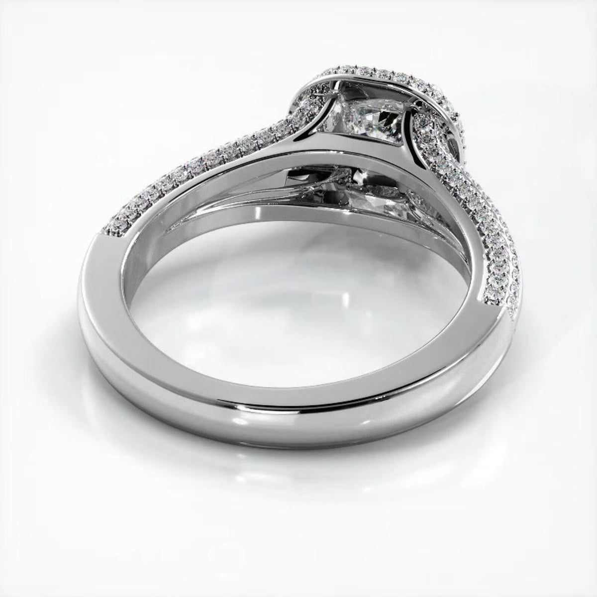 Perspective view showing the interior finish and under-gallery support of a white gold cushion cut lab diamond ring.