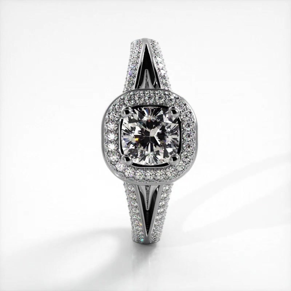 Direct top-down view of 2 CT cushion cut lab grown diamond ring with micro-pave halo set in white gold.
