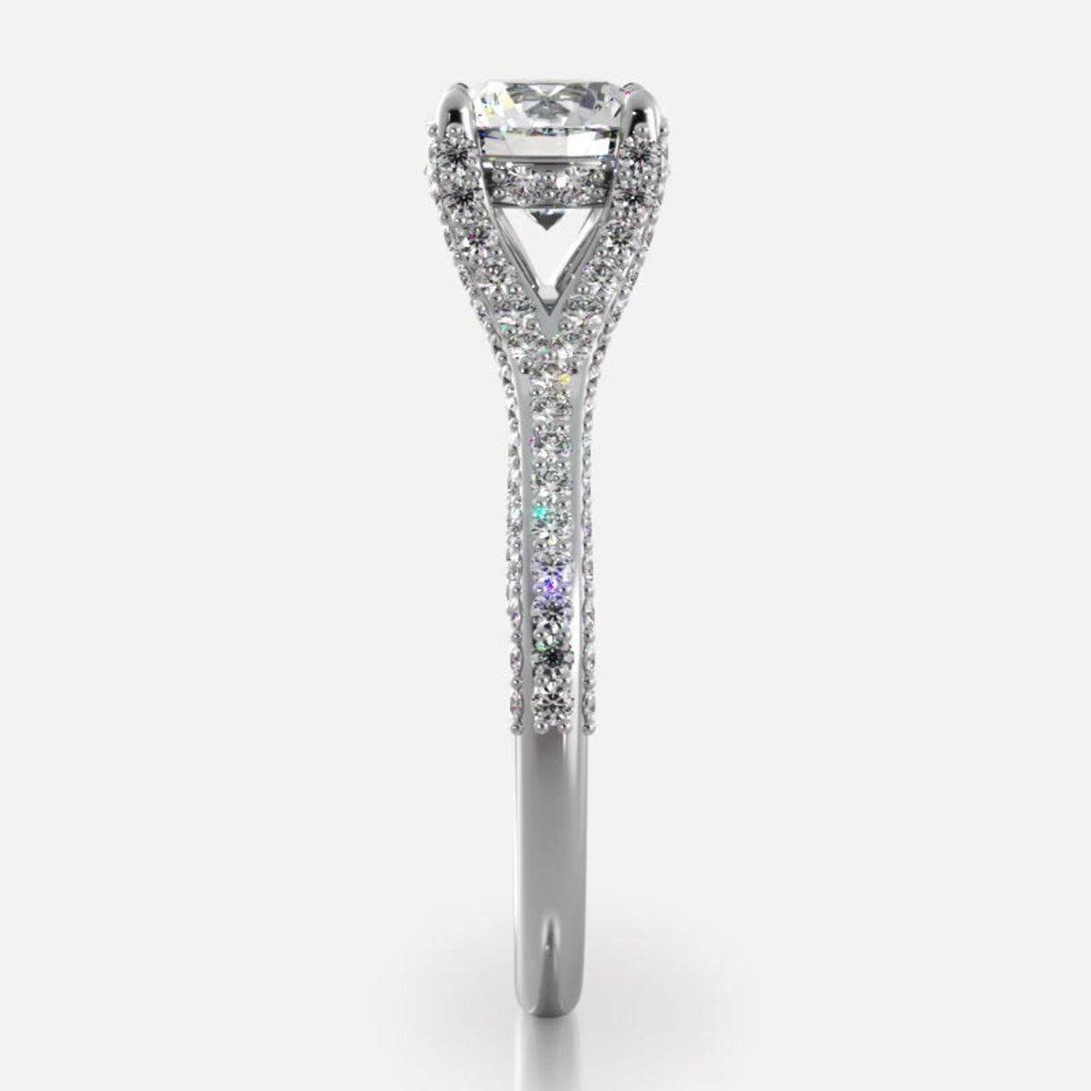 Side profile view of white gold 2 carat round cut lab diamond ring showcasing cathedral basket and pave band details.