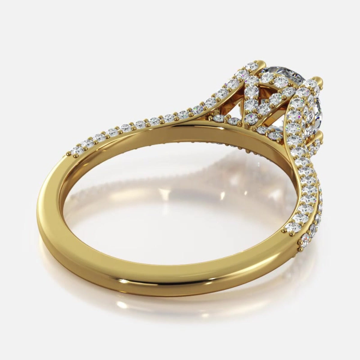 Angled perspective view of yellow gold 2 CT round lab grown diamond ring displaying cathedral shank and pave accents.