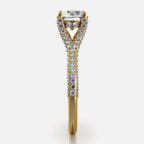 Side profile view of yellow gold 2 carat round lab grown diamond engagement ring showing elevated crown and micro-pave setting.