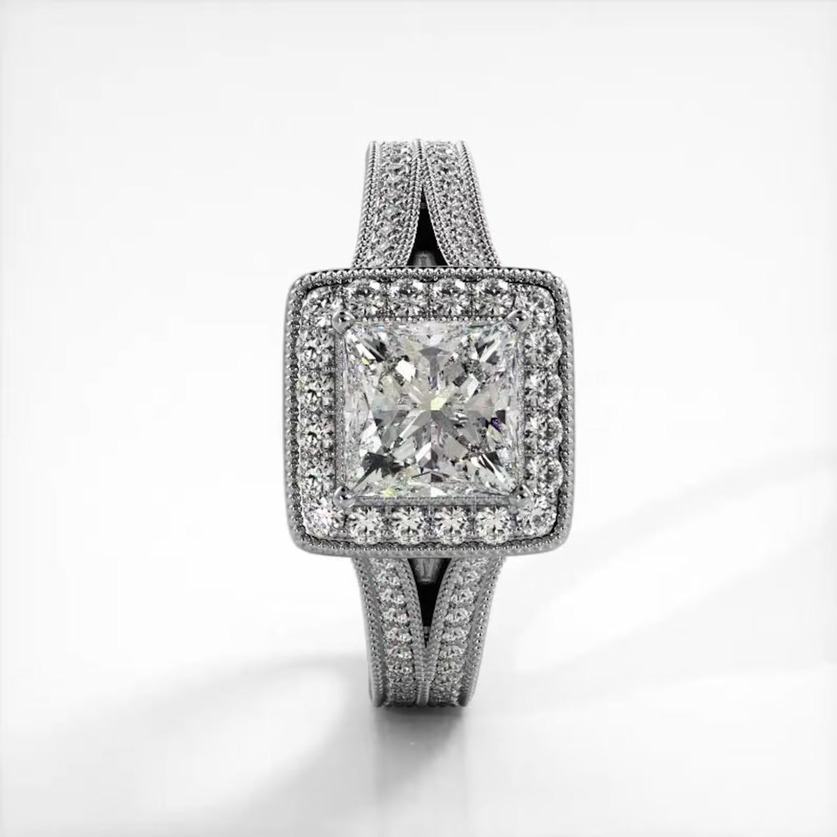Top-down view of 2 CT princess cut lab grown diamond ring with milgrain halo and split shank in white gold.