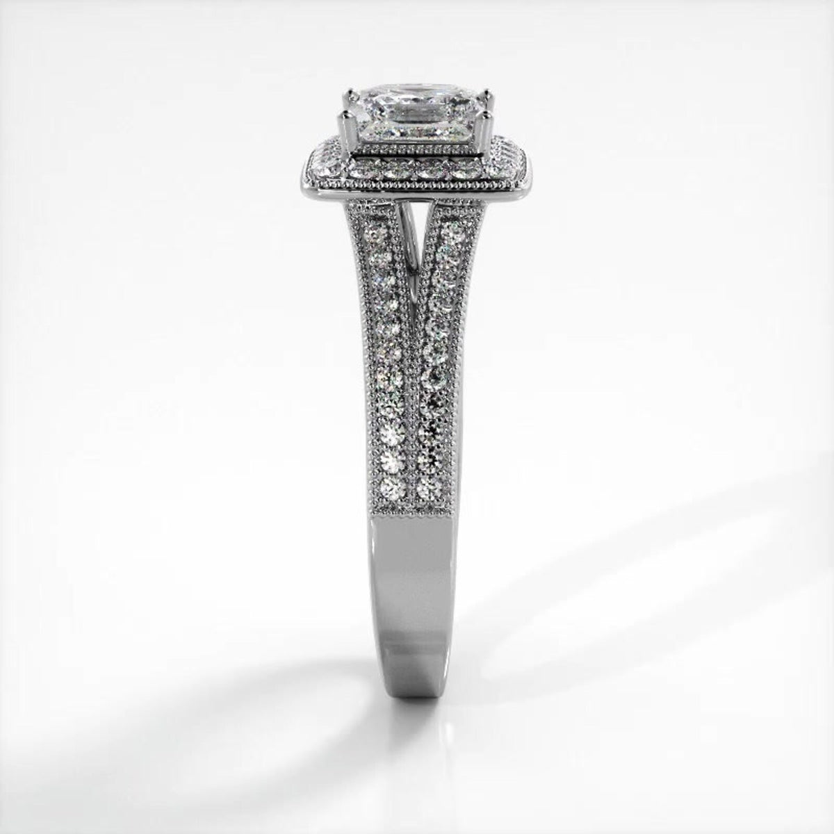 Side profile view of white gold 2 carat princess cut lab diamond engagement ring displaying pave split shank architecture.