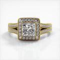 Direct front view of 2 CT princess cut lab diamond halo engagement ring with split shank in yellow gold.