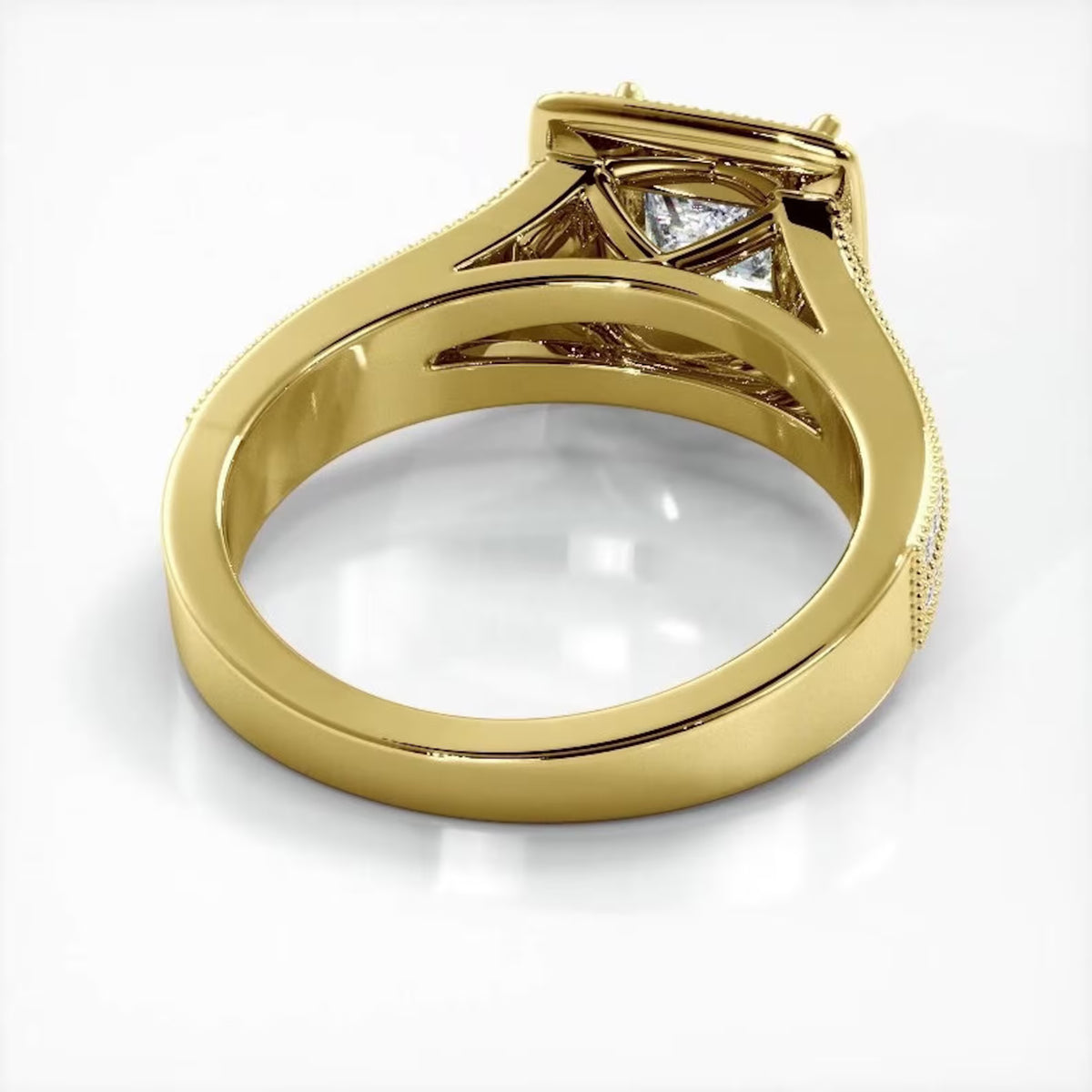 Angled perspective view showing smooth inner band and structural under-gallery of a yellow gold princess cut lab diamond ring.
