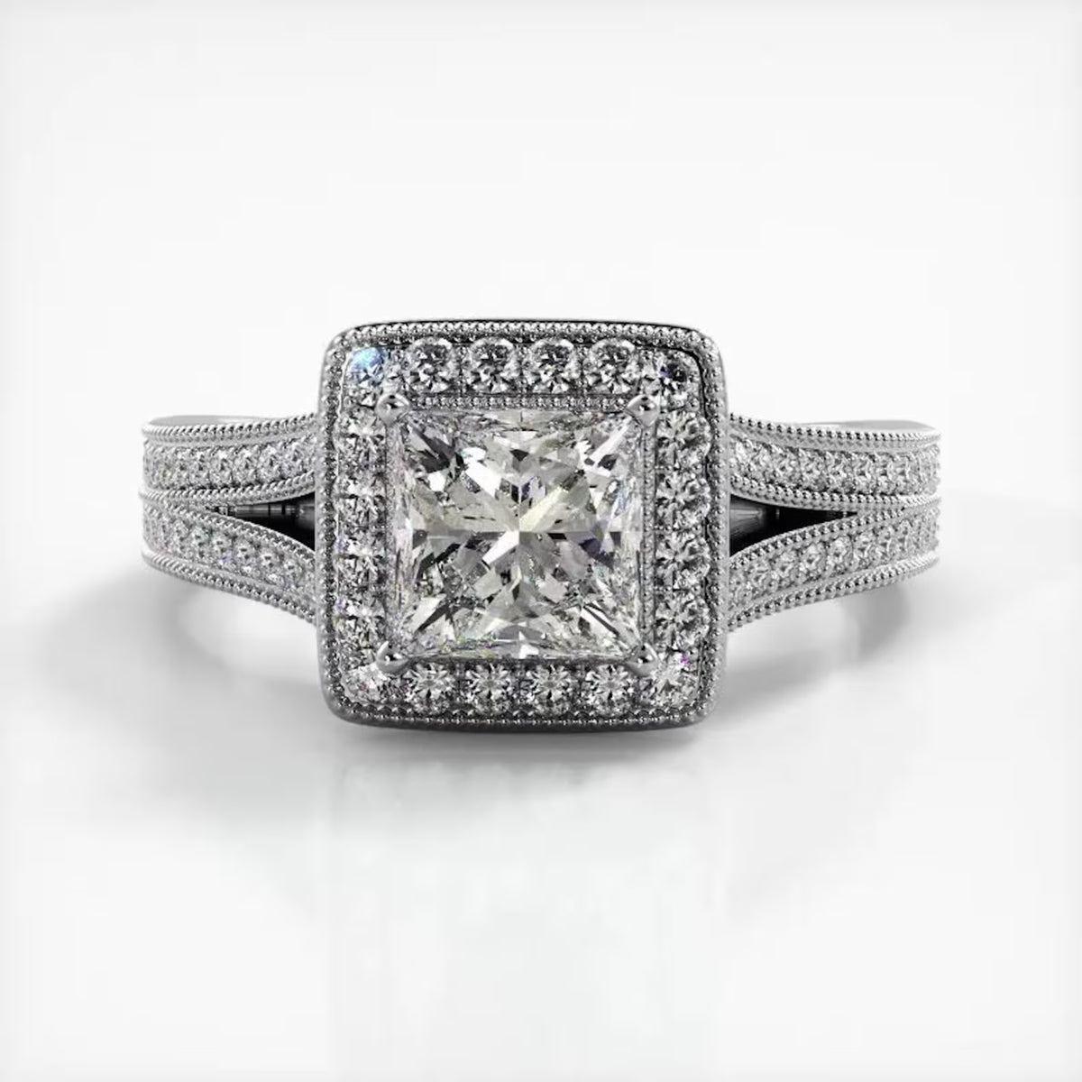 Direct front view of 2 CT princess cut lab diamond halo engagement ring with split shank in white gold.