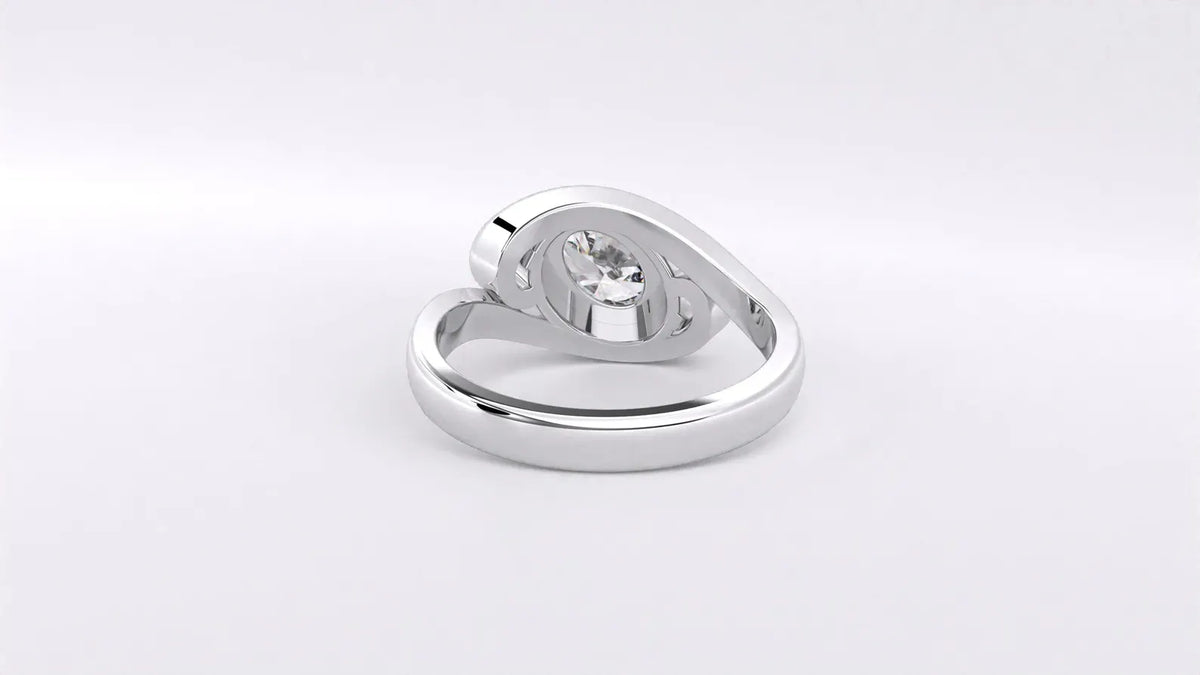 Rear view of white gold oval lab diamond bypass ring highlighting smooth inner band and under-gallery.