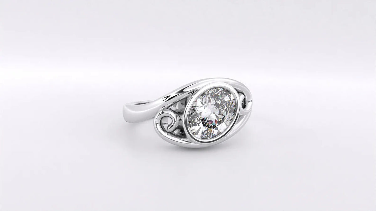 Close-up view of a 2 carat oval lab grown diamond framed in a bypass bezel setting with scroll accents.