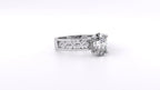 Side angle view of a 2 CT oval lab grown diamond engagement ring showing wave filigree shank in white gold.