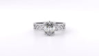 Direct front top-down view of 2 CT oval lab grown diamond solitaire ring featuring white gold filigree band.