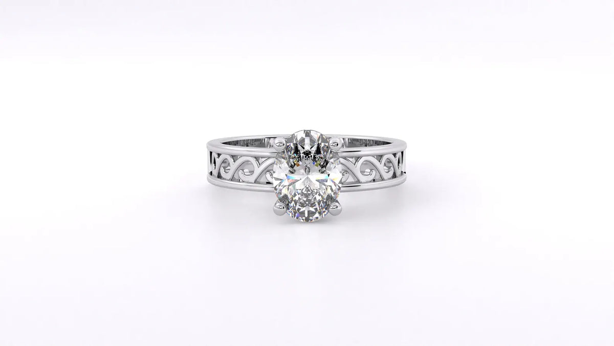 Direct front top-down view of 2 CT oval lab grown diamond solitaire ring featuring white gold filigree band.