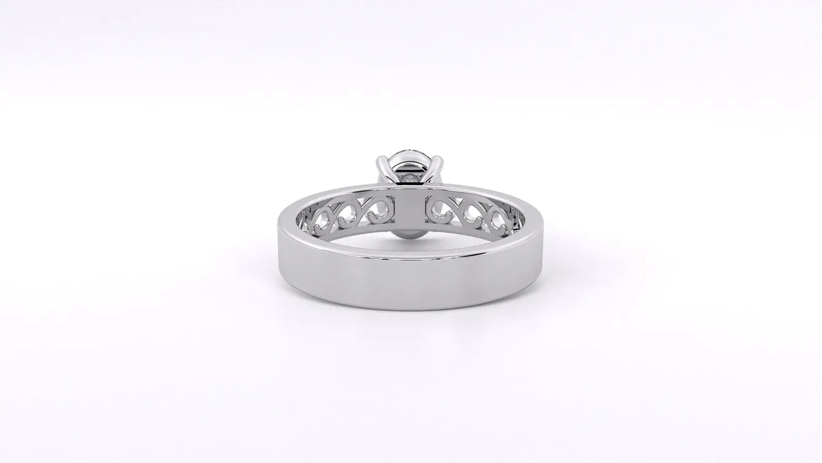 Bottom view of white gold oval lab diamond ring showing solid back shank transitioning to openwork filigree details