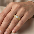 2 CT round cut bezel set lab grown diamond engagement ring worn on hand