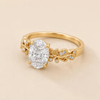 Angled perspective view of 3 Carat Oval Cut Lab Grown Diamond Engagement Ring with botanical leaf vine band in yellow gold