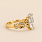 Side profile view highlighting 4-prong head and detailed leaf scrollwork on 3 Carat Oval Lab Diamond Engagement Ring