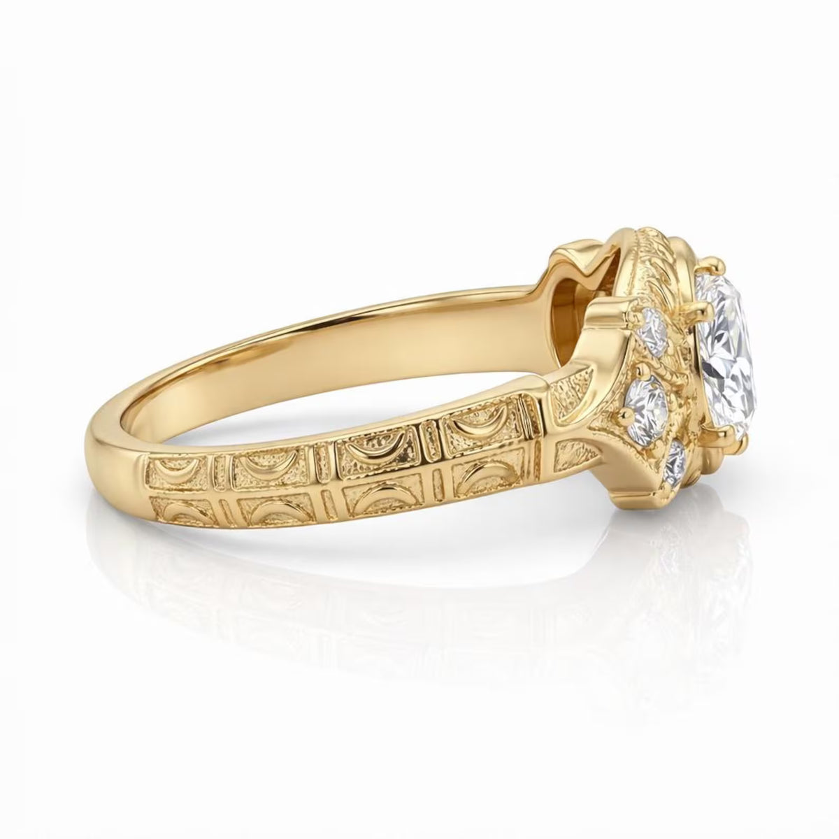 Side profile showing engraved pattern on yellow gold band of lab diamond ring