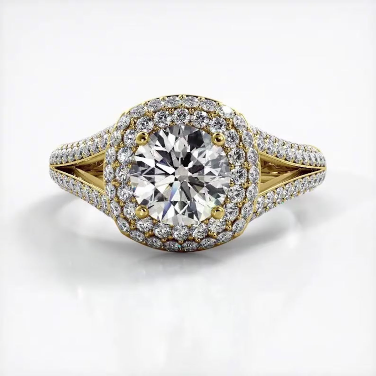 Front view of 3 CT round cut lab grown diamond engagement ring with double halo setting in yellow gold.