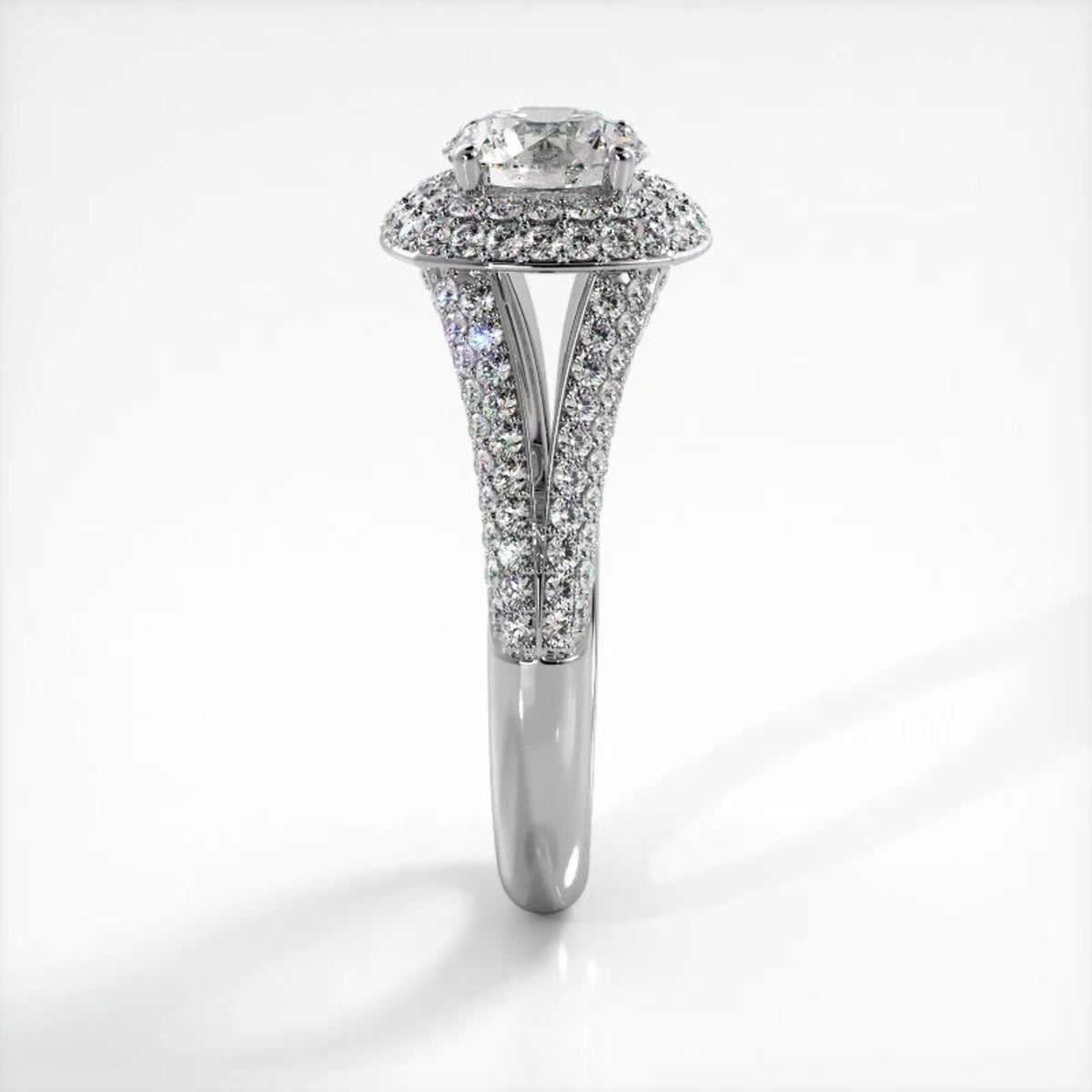 Side profile view of white gold 3 CT round lab diamond engagement ring with pavé split shank.
