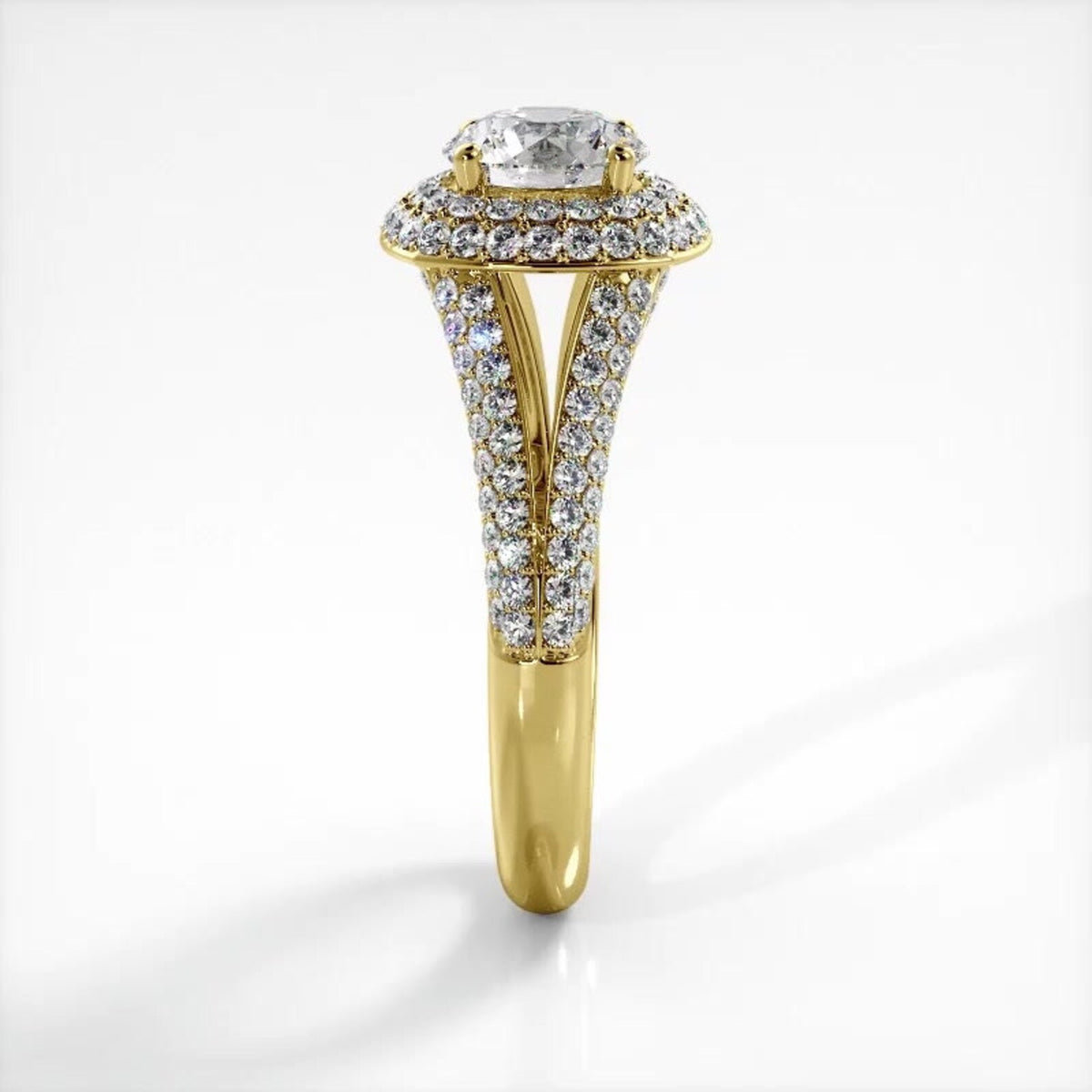 Side profile view of 3 carat round lab diamond engagement ring with yellow gold pavé band.
