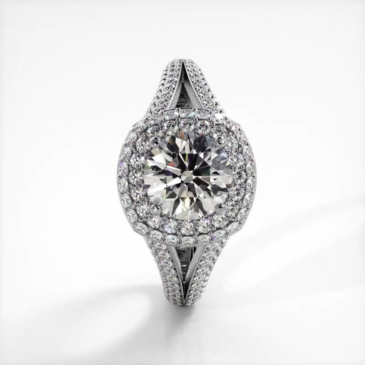 Top-down vertical view of 3 CT round lab created diamond double halo ring in white gold.