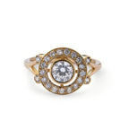 Top down view of a 2 carat round lab grown diamond ring featuring an Art Deco concentric target halo in yellow gold.